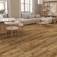 Modern living room with wooden flooring, furniture, and decor.