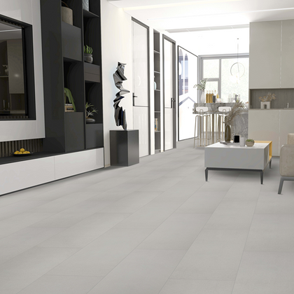 Modern living room with gray tiles, furniture, and decor.